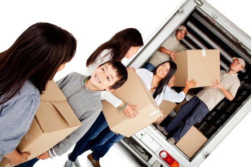 Furniture collection team handling bulky items in Kenley residential area