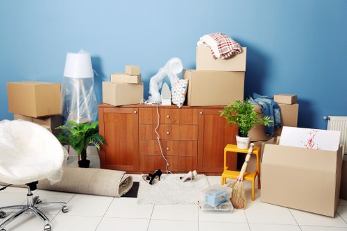Local movers handling office furniture with care in Kenley