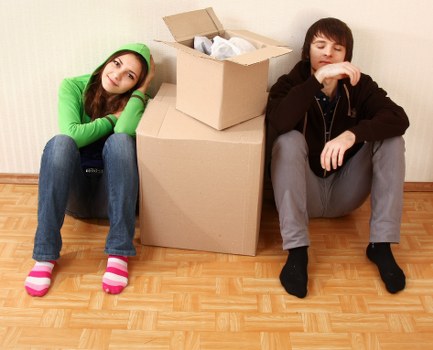 Packed boxes and furniture ready for collection by local movers