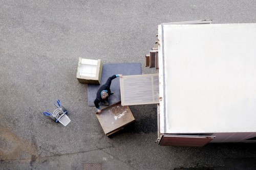 Moving professionals using protective equipment during a careful relocation