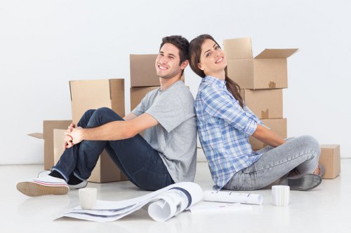 Professional movers handling furniture for a flat or office relocation