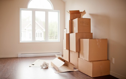 Removal van and moving boxes in a residential Kenley street
