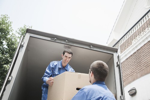 Professional removals team loading furniture for a Kenley move