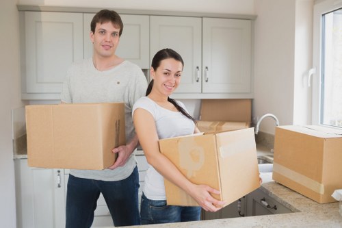 Professional movers handling items in a Kenley residential street